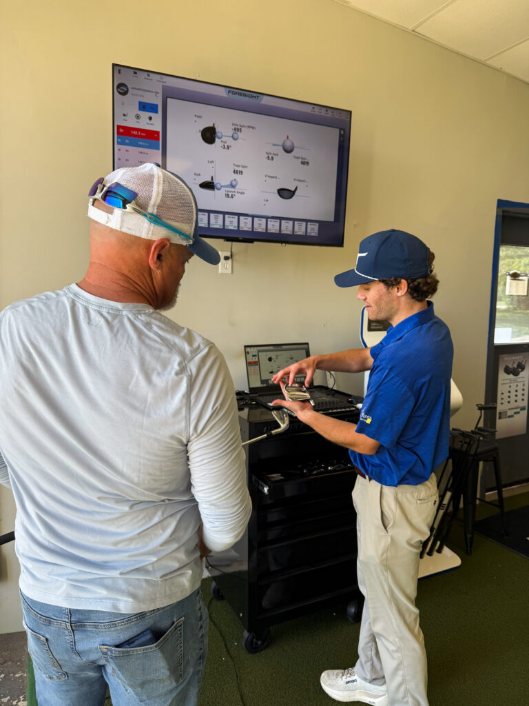 IMG_6334 Club Fitter showing customer different club head models